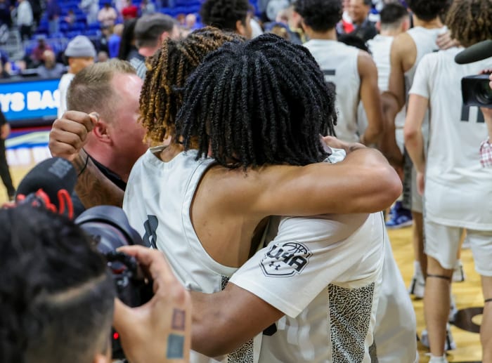 Plano East players embrace in the celebratory moments after clinching a UIL 6A state title, perfect 40-0 season on Saturday at the Alamodome in San Antonio.